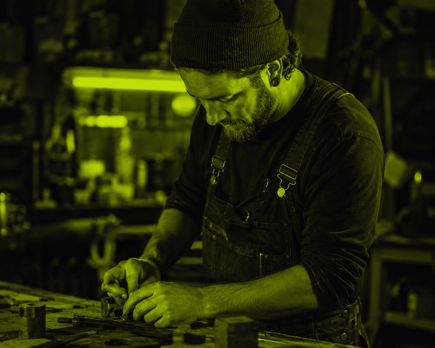 A maker working at a workbench